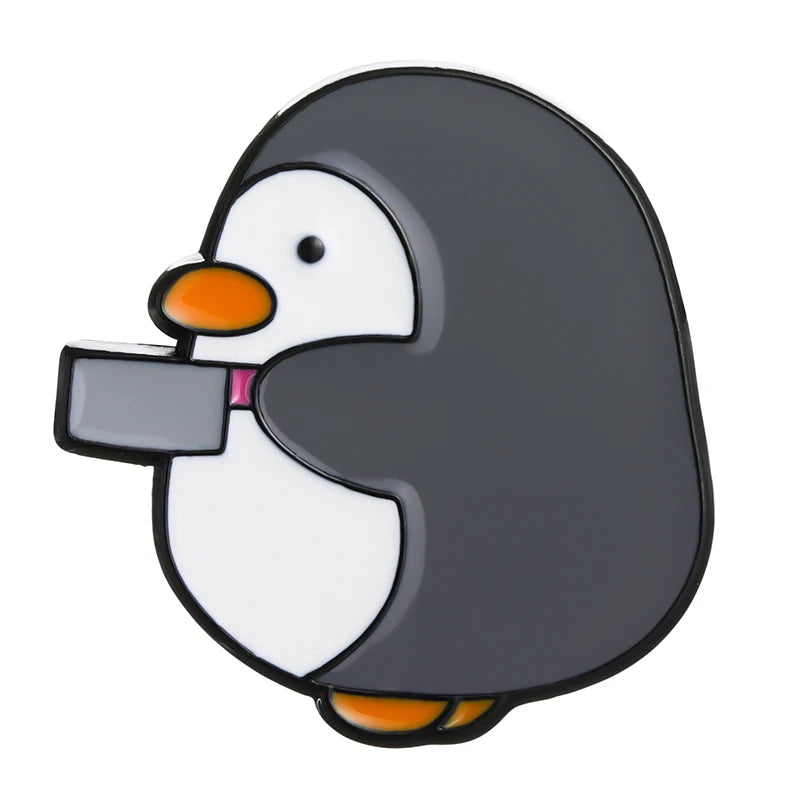 Pins de patos y pingüinos