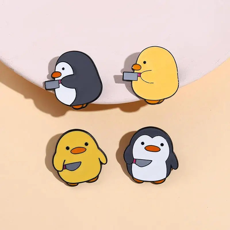 Pins de patos y pingüinos