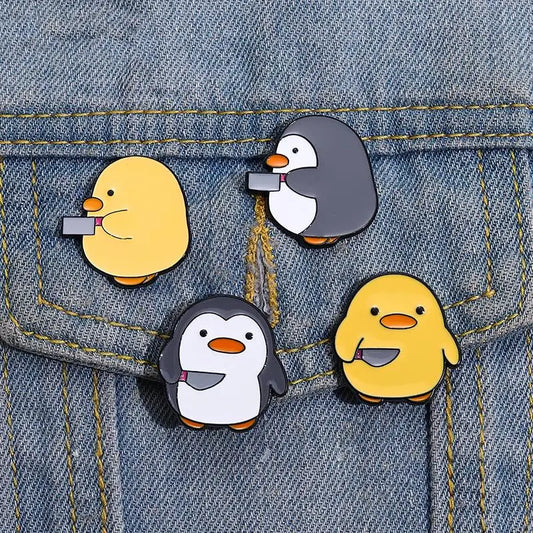 Pins de patos y pingüinos