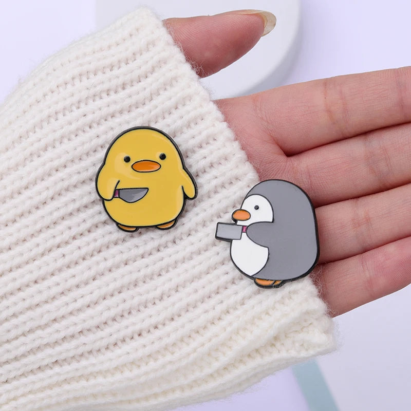 Pins de patos y pingüinos